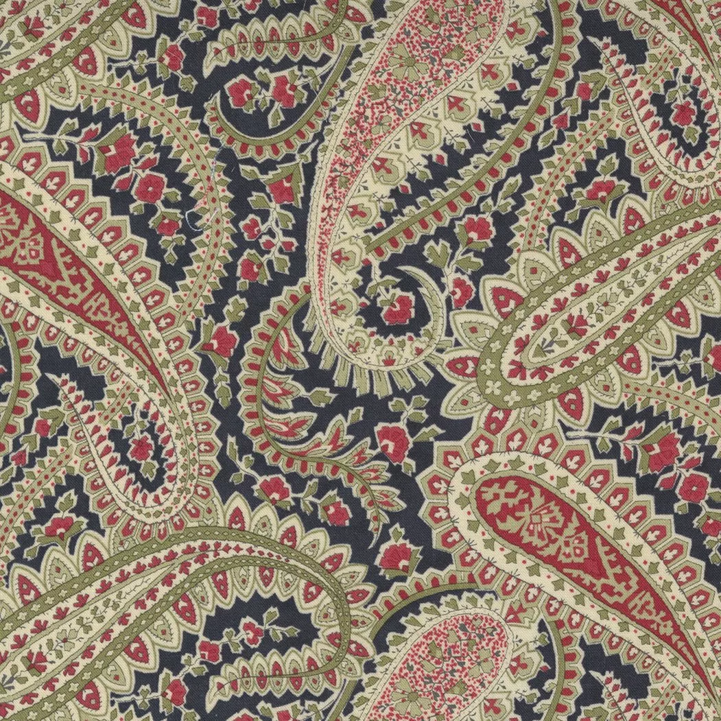 Moda Poinsettia Plaza. Large tossed crimson, holly and cream colored paisleys on an ebony colored background.