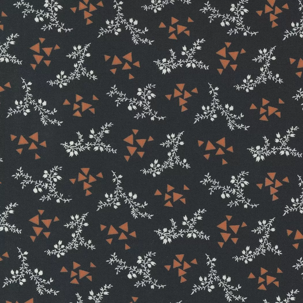 Moda Rustic Gatherings.Small white florals with amber geometric triangles on a black colored background.