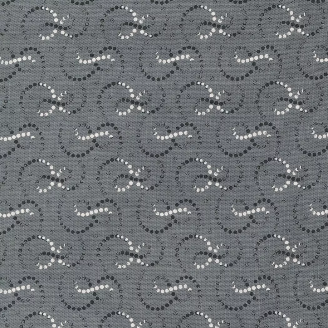 Moda Rustic Gatherings.Swirling white and black dotted lines on a gray colored background.